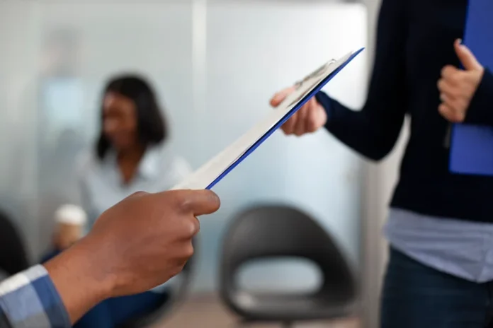 multiethnic-people-holding-clipboard